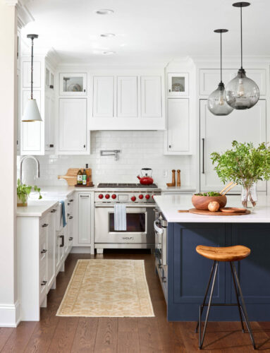 See how the two-tone cabinets add a modern and fresh feel to the kitchen?